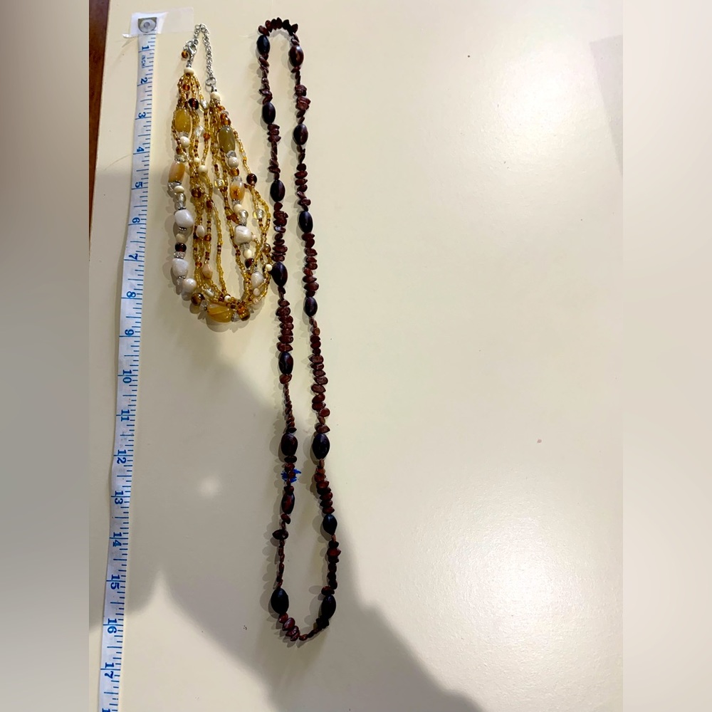 Two necklaces a multi strand and a single strand